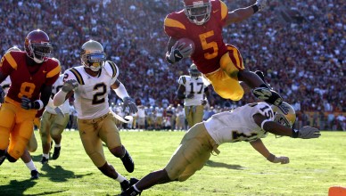 DECEMBER 3, 2005  LOS ANGELES, CA
USC's Reggie Bush leaps over UCLA's Marcus Cassel to score a touchdown in Los Angeles.